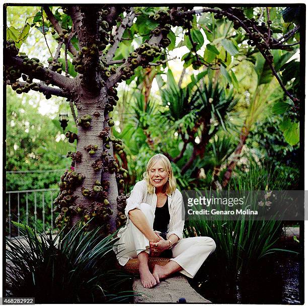 Singer Joni Mitchell sits under a fig tree in the courtyard of her Bel Air home photographed for Los Angeles Times on March 29, 2004 in Beverly...