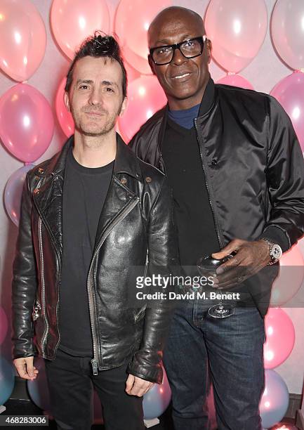 Kinder Aggugini and Charles Aboah attend the launch of Nicola Formichetti's new label "Nicopanda" at Selfridges on April 1, 2015 in London, England.