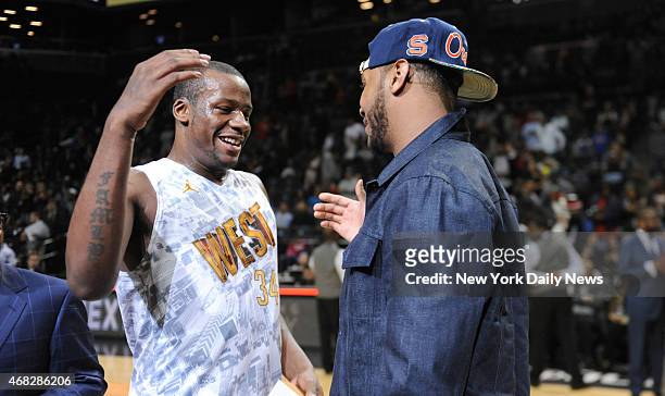 New York Knicks Carmelo Anthony and West MVP Cliff Alexander with trophy's after game action of the 2014 Jordan Brand Classic All American game at...
