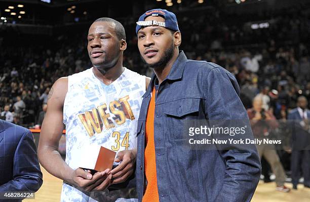 New York Knicks Carmelo Anthony and West MVP Cliff Alexander with trophy's after game action of the 2014 Jordan Brand Classic All American game at...