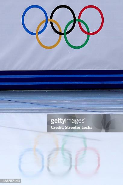 The Olympic rings are reflected in the ice during the Short Track Speed Skating Men's 1500m qualifying on day 3 of the Sochi 2014 Winter Olympics at...