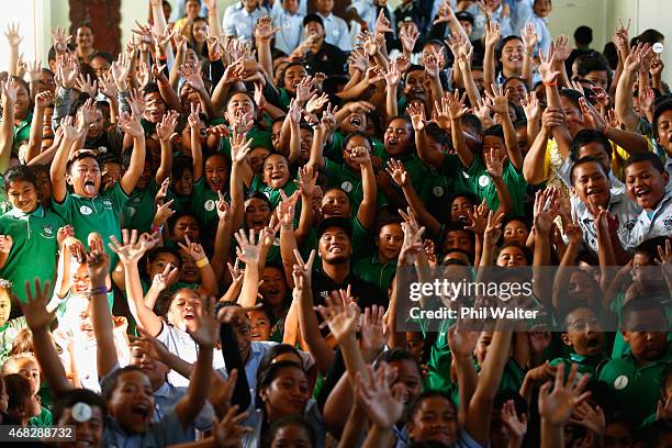 Stan Walker sits amongst school children after being announced as an ambassador for the FIFA U20 World Cup at Sutton Park School on April 2, 2015 in...