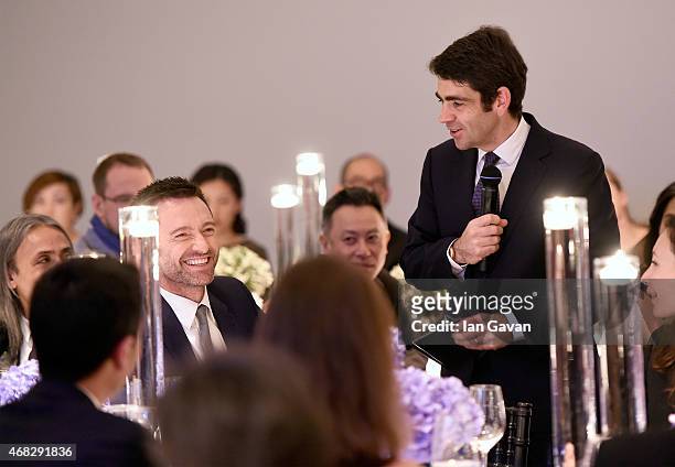 Actor Hugh Jackman laughs as Montblanc CEO Jerome Lambert speaks during the Montblanc Meisterstuck Sfumato Launch on April 1, 2015 in London, England.