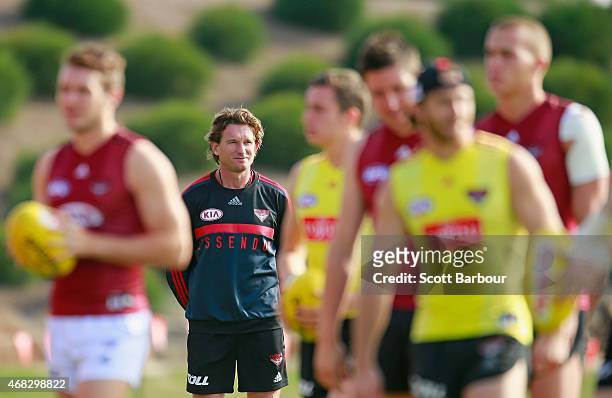 James Hird, coach of the Bombers looks on as his players train during an Essendon Bombers AFL training session at True Value Solar Centre on April 2,...