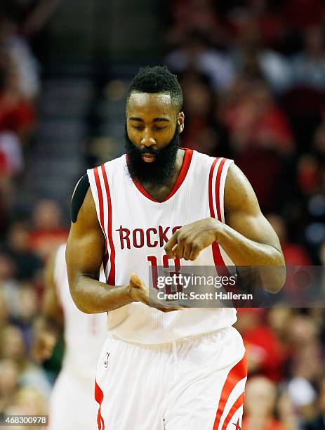 James Harden of the Houston Rockets celebrates a three-point shot against the Sacramento Kings during their game at the Toyota Center on April 1,...