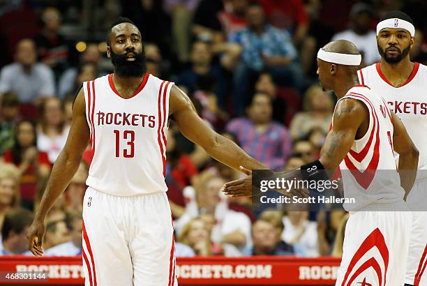 James Harden of the Houston Rockets celebrates a play with teammate Jason Terry during their game against the Sacramento Kings at the Toyota Center...