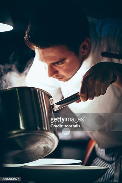 chef working in a commercial kitchen - chef vs chef stock pictures, royalty-free photos & images