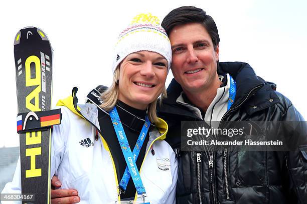 Gold medalist Maria Hoefl-Riesch of Germany celebrates with boyfriend Marcus Hoefl after the flower ceremony for the Alpine Skiing Women's Super...