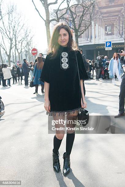 Wara Juana Gutierrez Mamani wears Jupe by Jackie dress, Maria La Rose socks and Miu Miu shoes on day 9 of Paris Collections: Women on March 11, 2015...