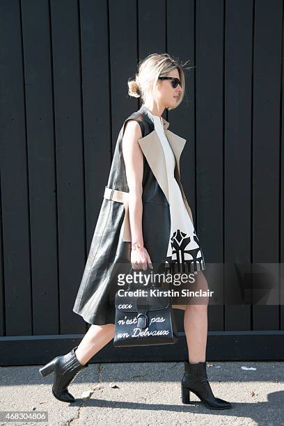 Fashion blogger Sofie Valkiers wears Silvian Heach dress, Gerard Darel coat and Delvaux bag on day 9 of Paris Collections: Women on March 11, 2015 in...