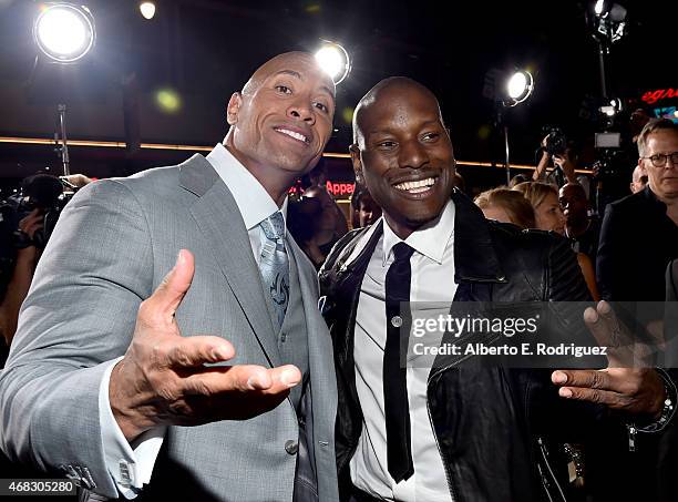 Actor Dwayne 'The Rock' Johnson and recording artist/actor Tyrese Gibson attend Universal Pictures' "Furious 7" premiere at TCL Chinese Theatre on...