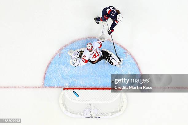 Alex Carpenter of United States scores her team's ninth goal past Florence Schelling of Switzerland during the Women's Ice Hockey Preliminary Round...