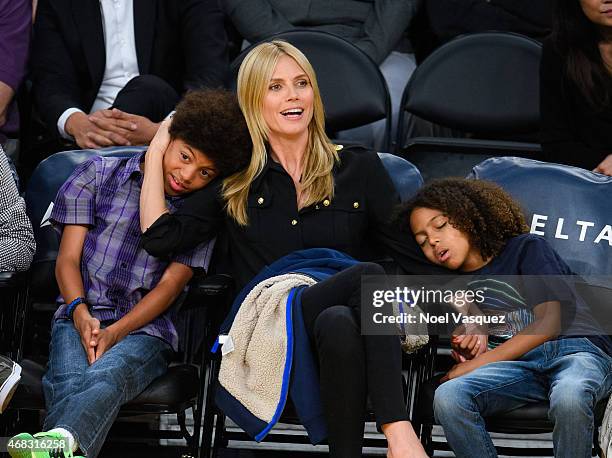 Henry Samuel, Heidi Klum and Johan Samuel attend a basketball game between the New Orleans Pelicans and the Los Angeles Lakers at Staples Center on...