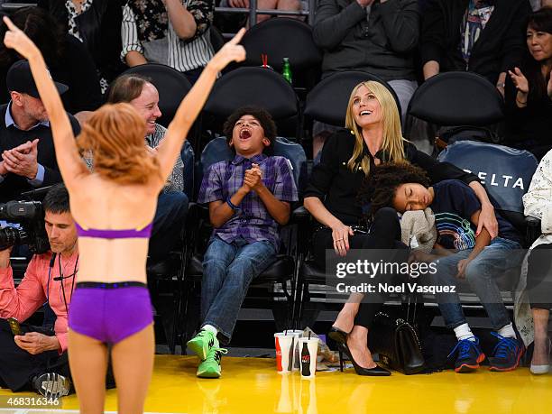 Henry Samuel, Heidi Klum and Johan Samuel attend a basketball game between the New Orleans Pelicans and the Los Angeles Lakers at Staples Center on...