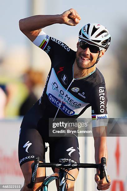 Tom Boonen of Belgium and the Qmega Pharma - Quick Step team celebrates after winning stage two of the Tour of Qatar from Camel Race Track to Al Khor...