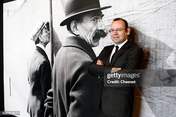 Commissioner of the exhibition, Clement Cheroux poses in front of a picture by french photographer Henri Cartier-Bresson during the inauguration of...