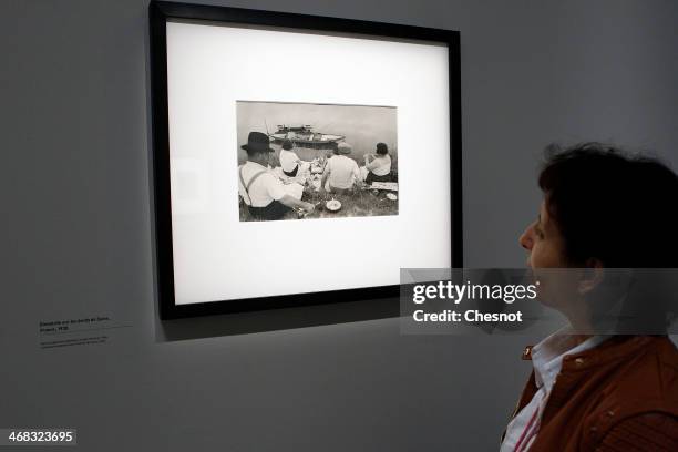 Visitor looks at a picture by french photographer Henri Cartier-Bresson during the inauguration of his exhibition at Centre Pompidou on February 10,...