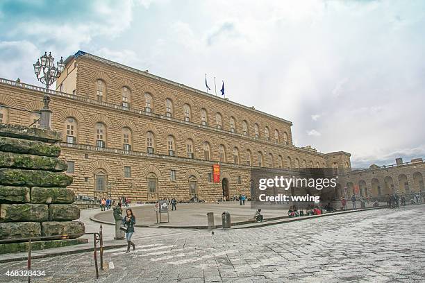 the pitti palace near the arno river in florence, italy. - pitti stockfoto's en -beelden