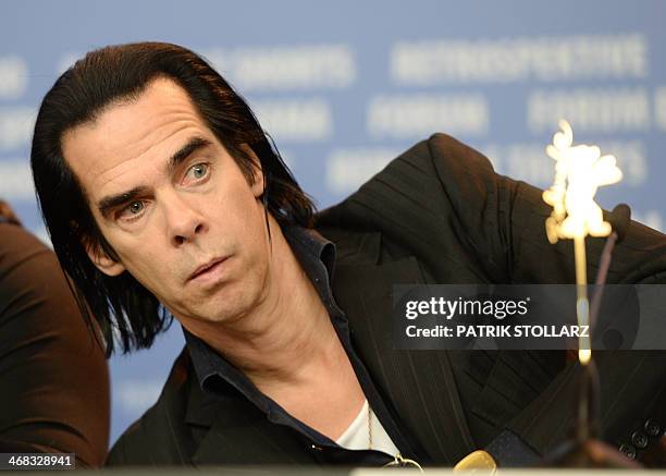 Australian screenwriter Nick Cave attends a press conference for the film "20,000 Days on Earth" presented in the Berlinale Panorama section of the...