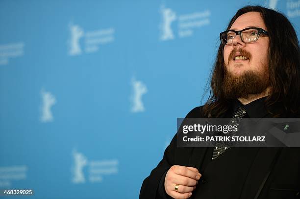 British producer Iain Forsyth poses at a photocall for the film "20,000 Days on Earth" presented in the Berlinale Panorama section of the 64th...