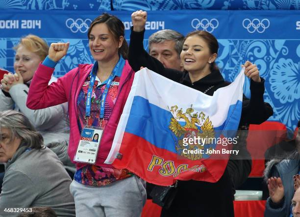 Yelena Isinbayeva and Alina Kabayeva attend the Short Track events on day 3 of the Sochi 2014 Winter Olympics at Iceberg Skating Palace on February...