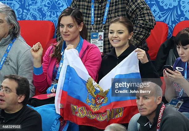 Yelena Isinbayeva and Alina Kabayeva attend the Short Track events on day 3 of the Sochi 2014 Winter Olympics at Iceberg Skating Palace on February...