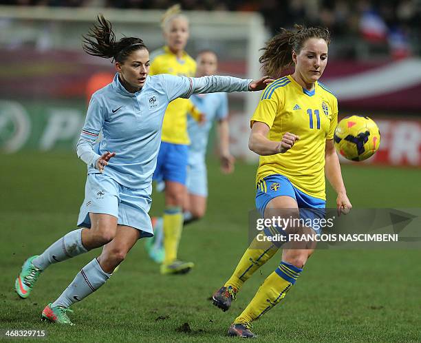 France's defender Laure Boulleau vies with Sweden's midfielder Antonia Goeransson during the women's friendly international football match between...