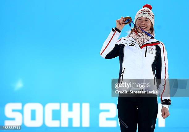Gold medalist Anastasiya Kuzmina of Slovakia celebrates during the medal ceremony for the Biathlon Women's 7.5 km Sprint on day 3 of the Sochi 2014...