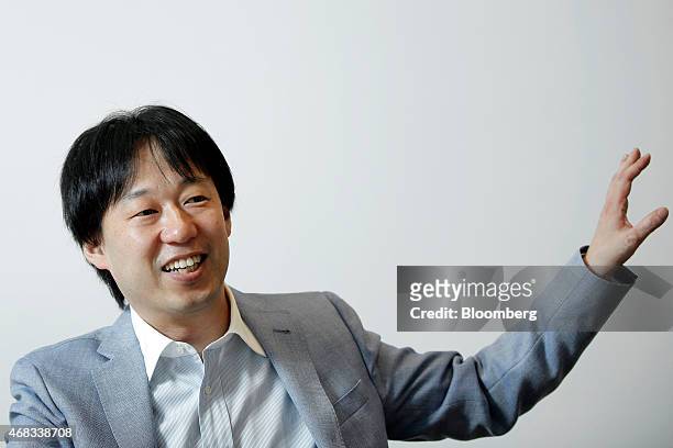 Isao Moriyasu, president and chief executive officer of DeNA Co., gestures as he speaks during an interview at the company's headquarters in Tokyo,...