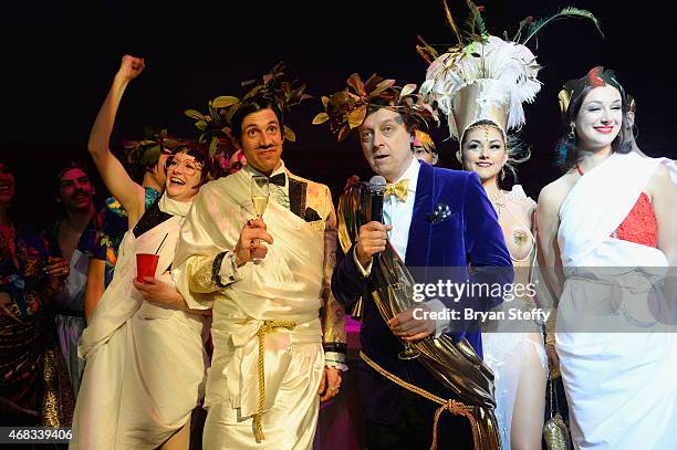 Cast members Joy Jenkins The Gazillionaire look on as producer Ross Mollison speaks to attendees during the show's fourth anniversary party at...