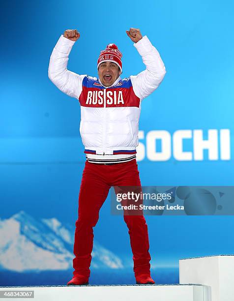 Silver medalist Albert Demchenko of Russia celebrates during the medal ceremony for the Men's Luge Singles on day 3 of the Sochi 2014 Winter Olympics...