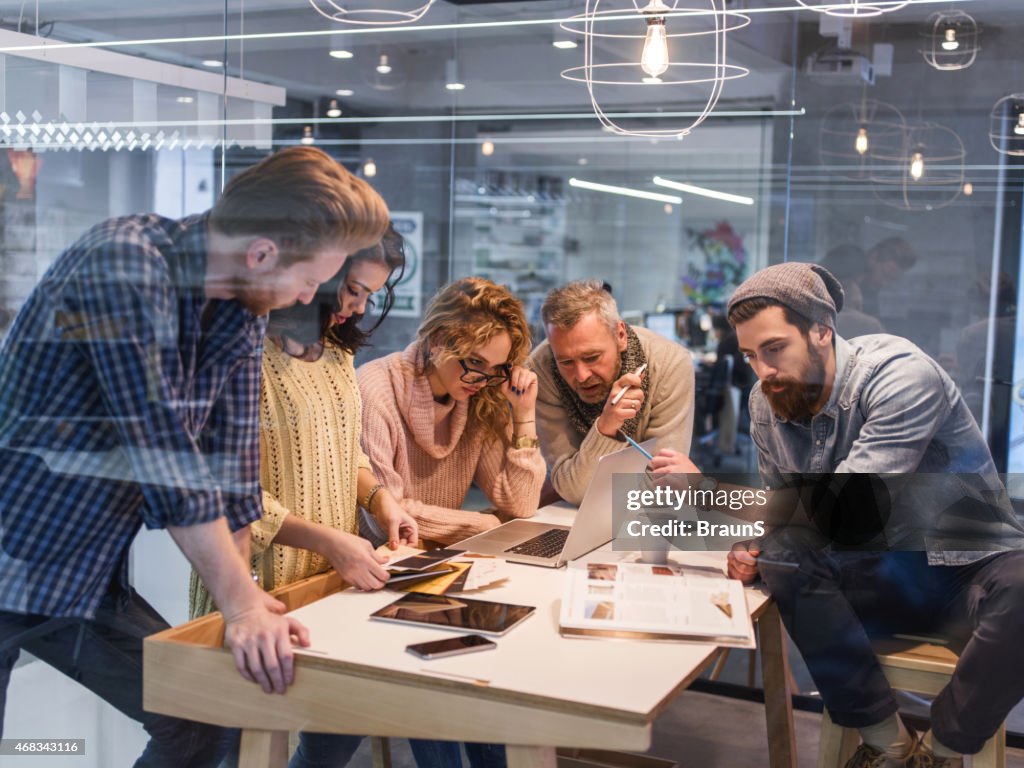 Multi-tasking creative people working in the office.