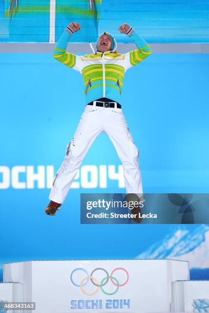 Gold medalist Felix Loch of Germany celebrates during the medal ceremony for the Men's Luge Singles on day 3 of the Sochi 2014 Winter Olympics at...