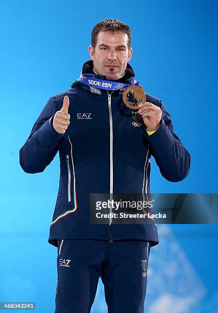 Bronze medalist Armin Zoeggeler of Italy celebrates during the medal ceremony for the Men's Luge Singles on day 3 of the Sochi 2014 Winter Olympics...