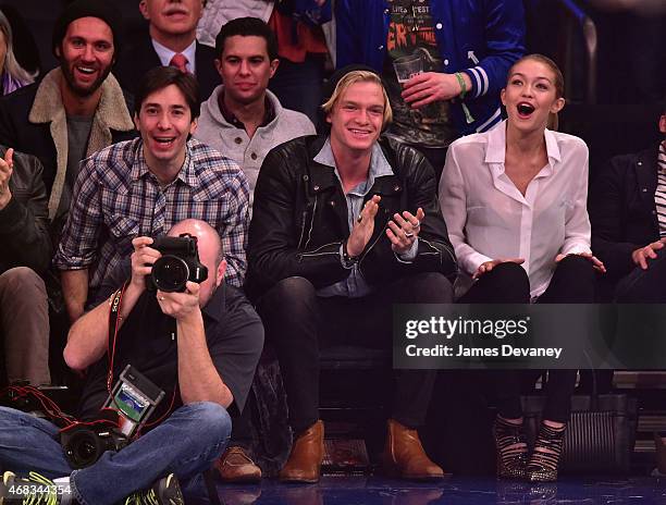 Justin Long, Cody Simpson and Gigi Hadid attend Brooklyn Nets vs New York Knicks game at Madison Square Garden on April 1, 2015 in New York City.