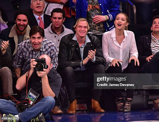 Justin Long, Cody Simpson and Gigi Hadid attend Brooklyn Nets vs New York Knicks game at Madison Square Garden on April 1, 2015 in New York City.