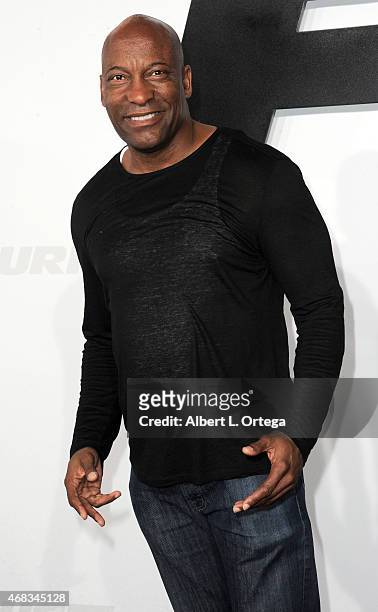 Director John Singleton arrives for the Premiere Of Universal Pictures' "Furious 7" held at TCL Chinese Theatre on April 1, 2015 in Hollywood,...