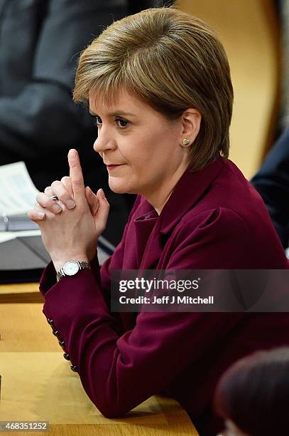 First Minister Nicola Sturgeon attends First Ministers Questions at the Scottish Parliament on April 2, 2015 in Edinburgh,Scotland. Tonight will see...