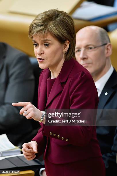 First Minister Nicola Sturgeon attends First Ministers Questions at the Scottish Parliament on April 2, 2015 in Edinburgh,Scotland. Tonight will see...