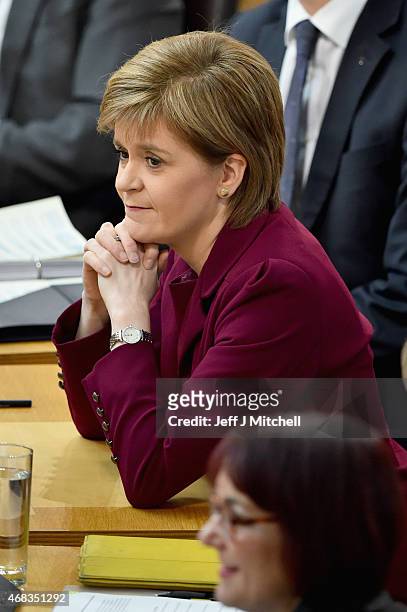 First Minister Nicola Sturgeon attends First Ministers Questions at the Scottish Parliament on April 2, 2015 in Edinburgh,Scotland. Tonight will see...