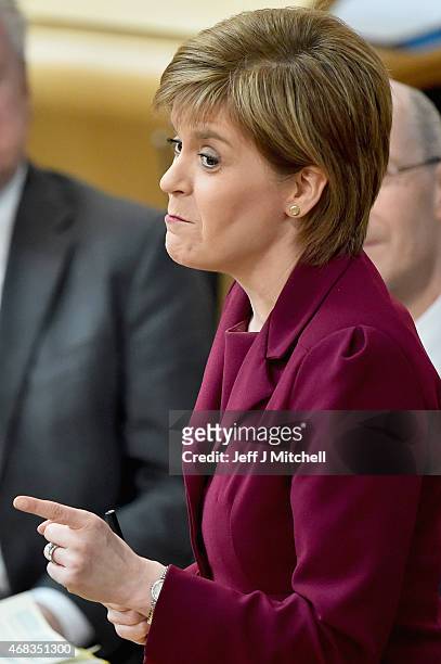 First Minister Nicola Sturgeon attends First Ministers Questions at the Scottish Parliament on April 2, 2015 in Edinburgh, Scotland. Tonight will see...
