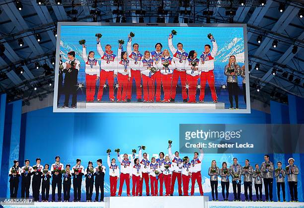 Silver medalists Kaetlyn Osmond, Patrick Chan, Kevin Reynolds, Meagan Duhamel, Eric Radford, Kirsten Moore-Towers, Dylan Moscovitch, Tessa Virtue and...