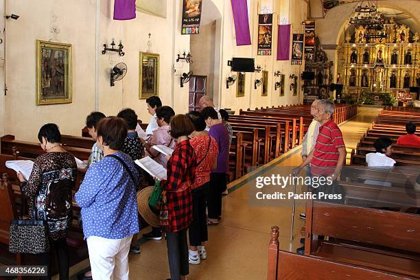 Group of catholic devotees taking a prayer inside of San Ildefonso De Toledo Parish Church in Tanay, Rizal as part of their Visita Inglesia . The...
