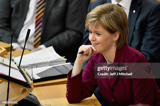 First Minister Nicola Sturgeon attends First Minister's Questions at the Scottish Parliament on April 2, 2015 in Edinburgh, Scotland. Tonight will...