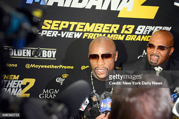 Floyd "Money" Mayweather answers questions from the media before he and Marcos "El Chino" Maidana hosted a Times Square press conference in New York...
