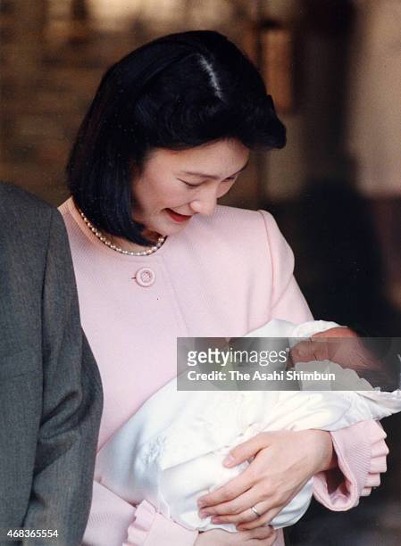 Princess Kiko of Akishino holding her second daughter Kako leaves the Imperial Household Agency Hospital on January 6, 1995 in Tokyo, Japan.