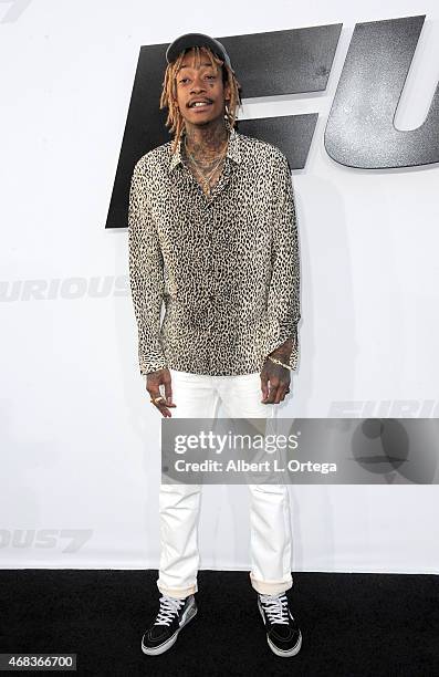 Rapper Wiz Khalifa arrives for the Premiere Of Universal Pictures' "Furious 7" held at TCL Chinese Theatre on April 1, 2015 in Hollywood, California.