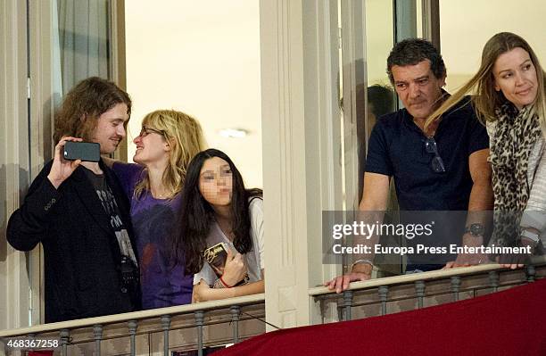 Antonio Banderas , Nicole Kimpel and Melanie's Griffith son, Alexander Bauer, attend procesion during Holy Week celebration on April 2, 2015 in...