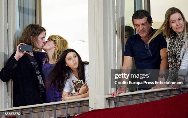 Antonio Banderas , Nicole Kimpel and Melanie's Griffith son, Alexander Bauer, attend procesion during Holy Week celebration on April 2, 2015 in...