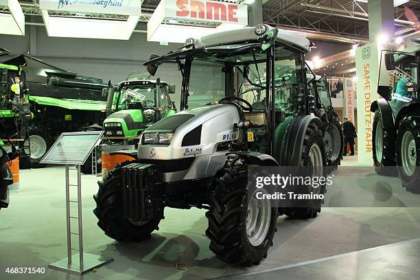 lamborghini tractor on the agro show - lamborghini grey stock pictures, royalty-free photos & images